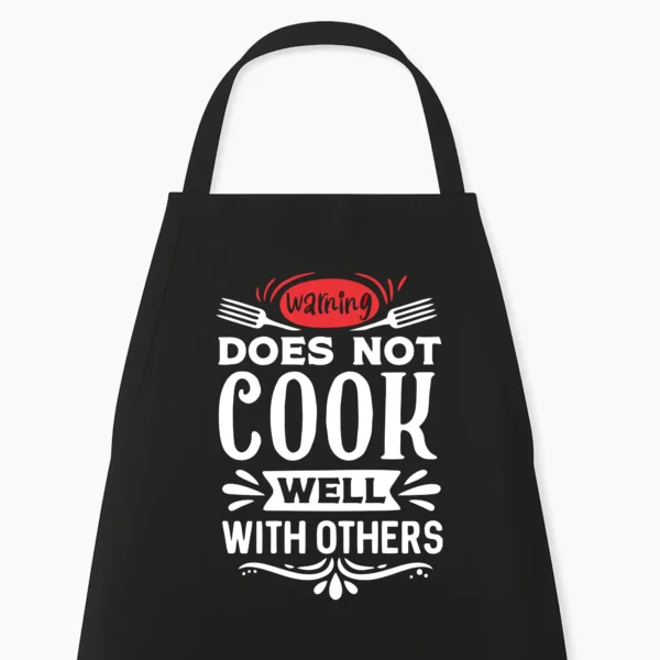 Keukenschort Warning, does not cook well with others